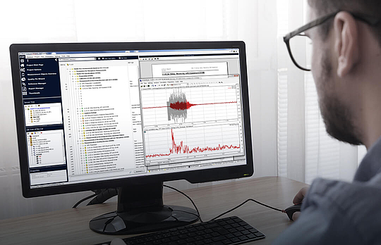 A man with glasses works on analysis in ACQUA