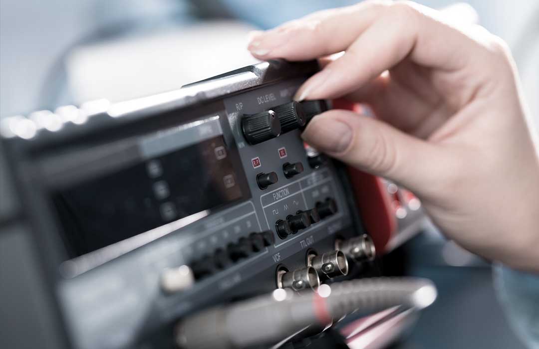 A hand tuninig a hardware device.